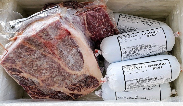 Packaged ground beef and a large cut of meat in a freezer container.